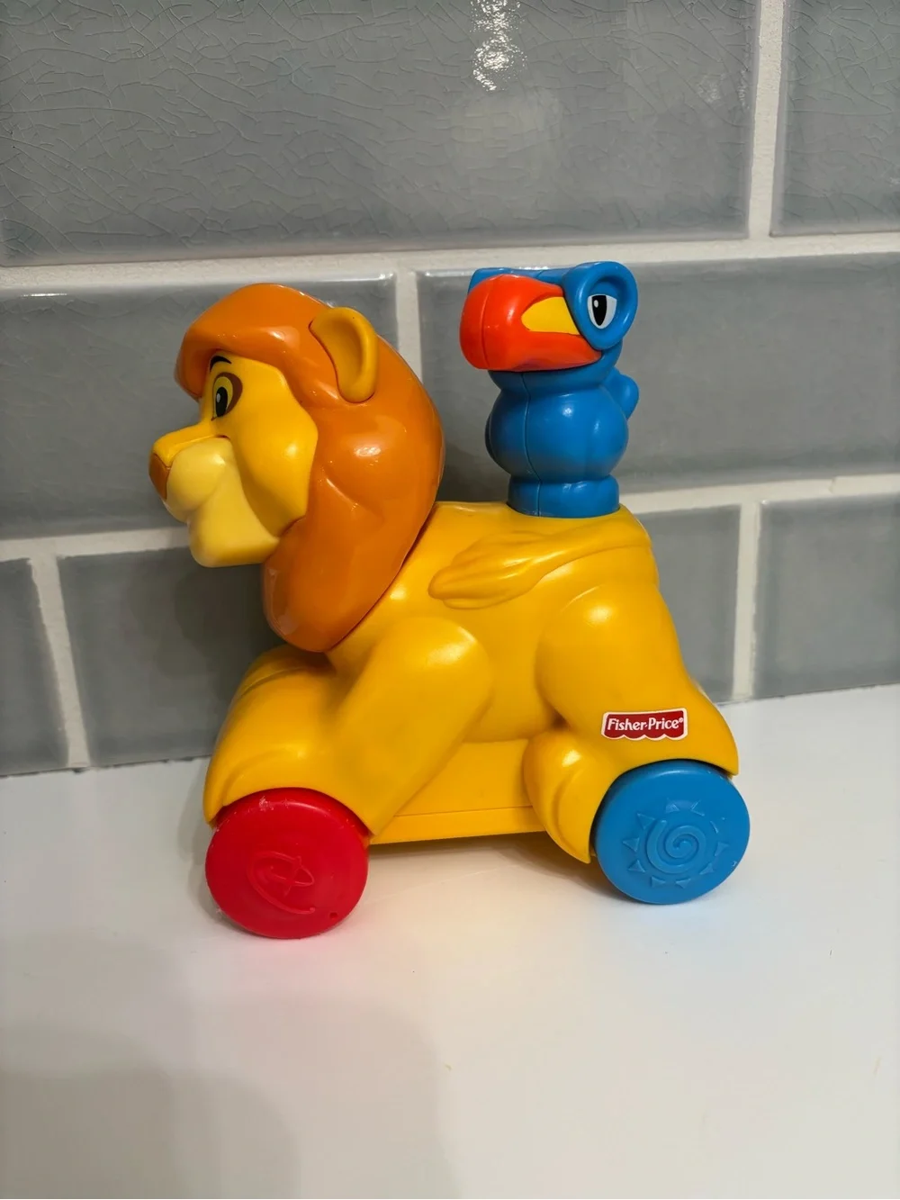 Fisher-Price Disney Baby Rollin' Tunes Mufasa push-along toy